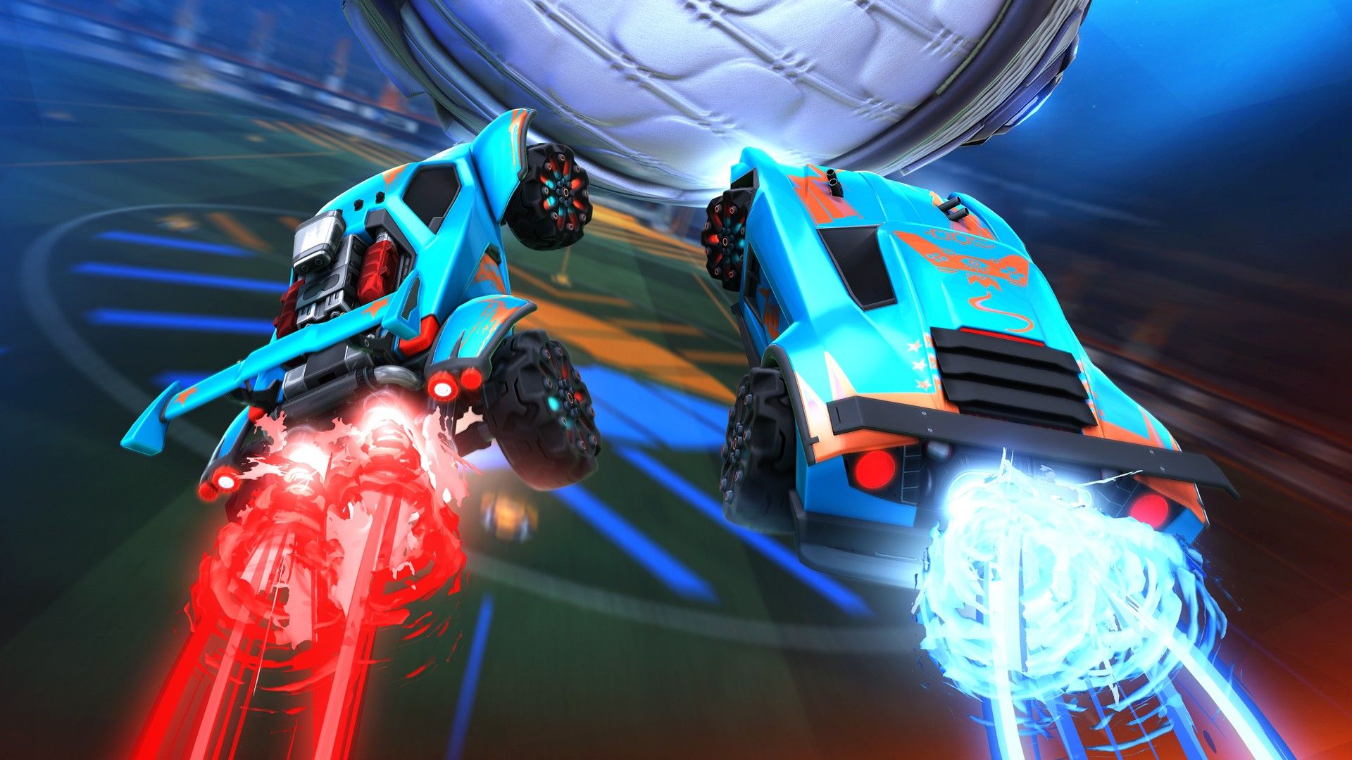Two cars boosting into the air, going after the Rocket Ball